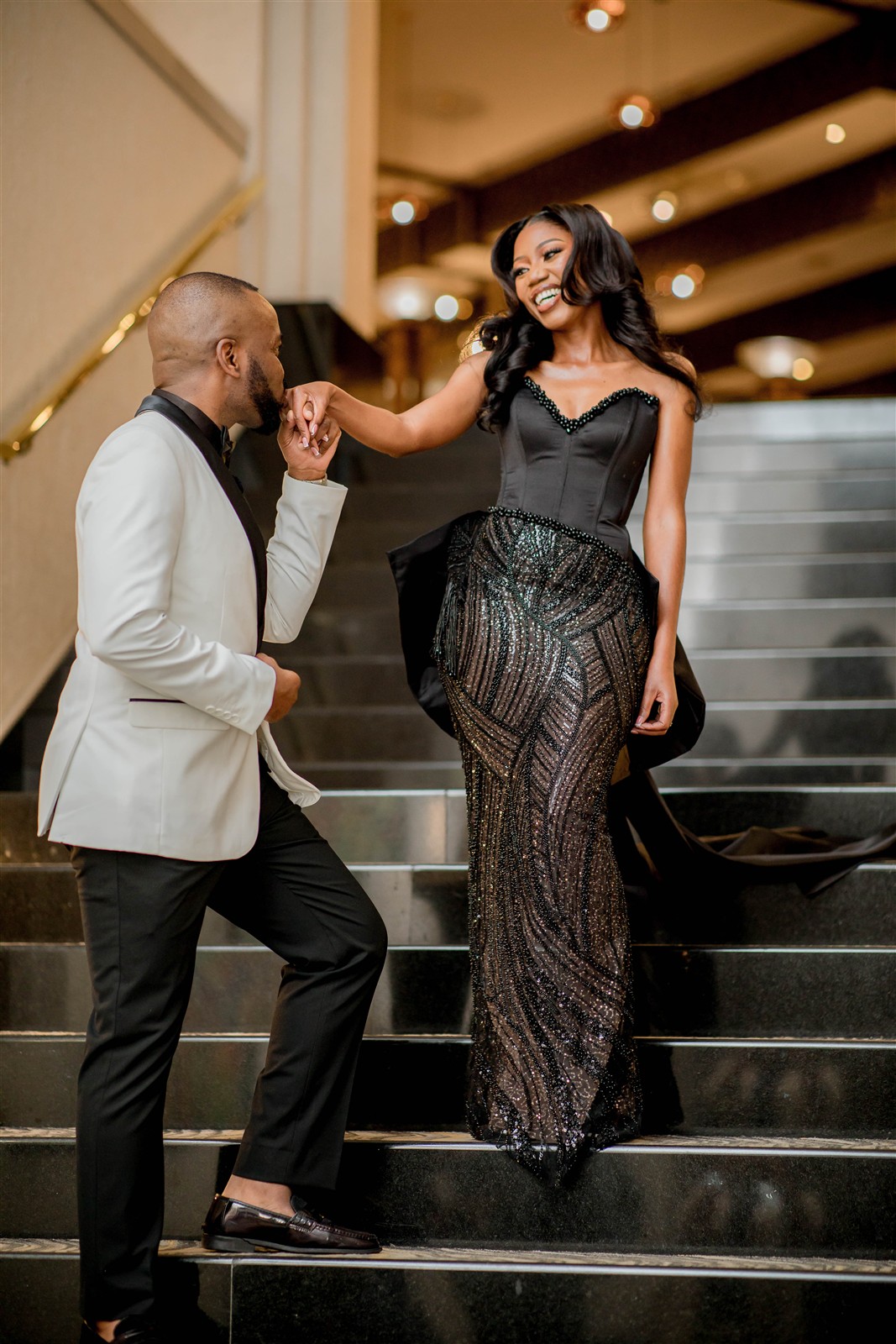 Ndauda kissing Shiwa's hand